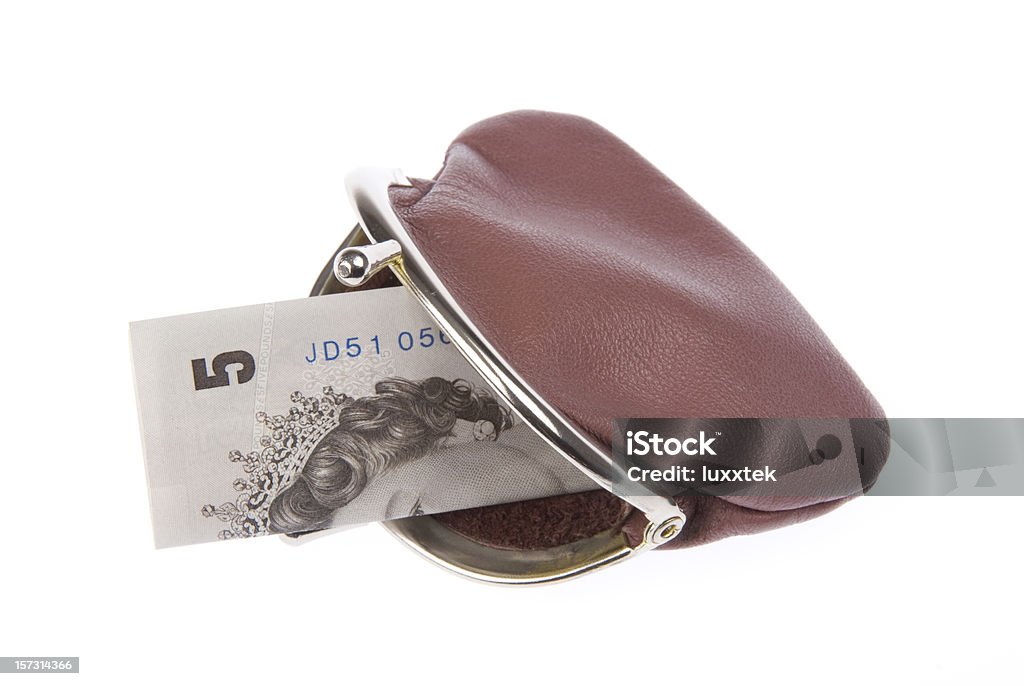 Leather purse with 5 pounds note  British Currency Stock Photo