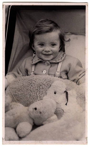 A baby girl sitting in a pram c1947-8. Yes, I admit it - it's me...