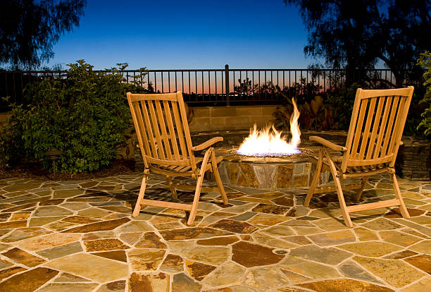 Luxurious outdoor fire pit with seating to view the sunset stock photo