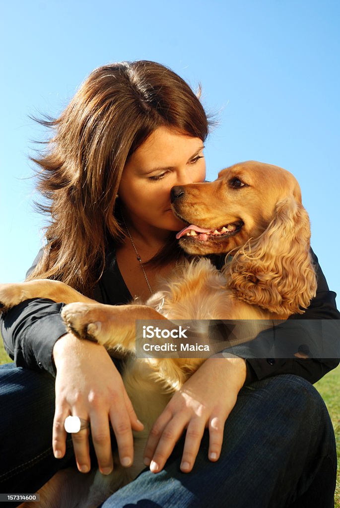 Best friends Girl hugging her cocker dog, hugging. Confidence Stock Photo