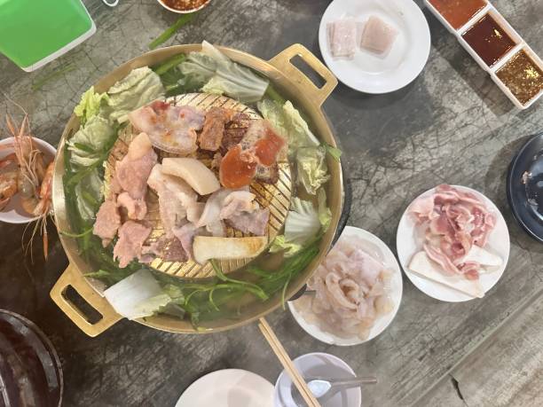 istock Moo Kata - Thai BBQ on the table. 1573146957