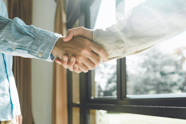 istock Businessmans handshake after good deal. 1573148017