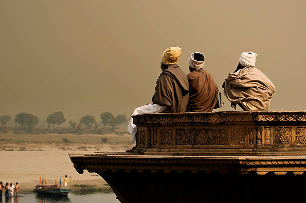 istock Three sadhus meditating by the Yamuna in Vrindavan 157314895
