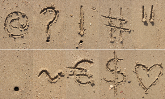 Abbreviation SPF written on sand and starfish at beach, above view