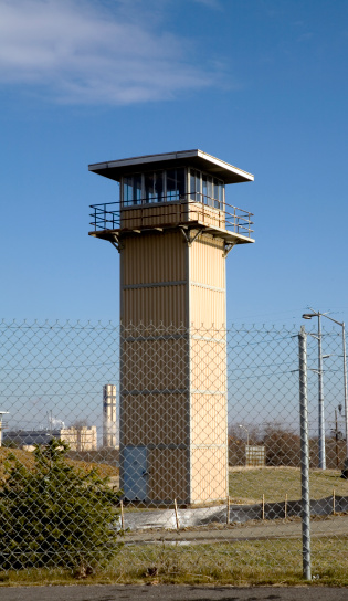 Prison Guard Lookout Tower behind Fence