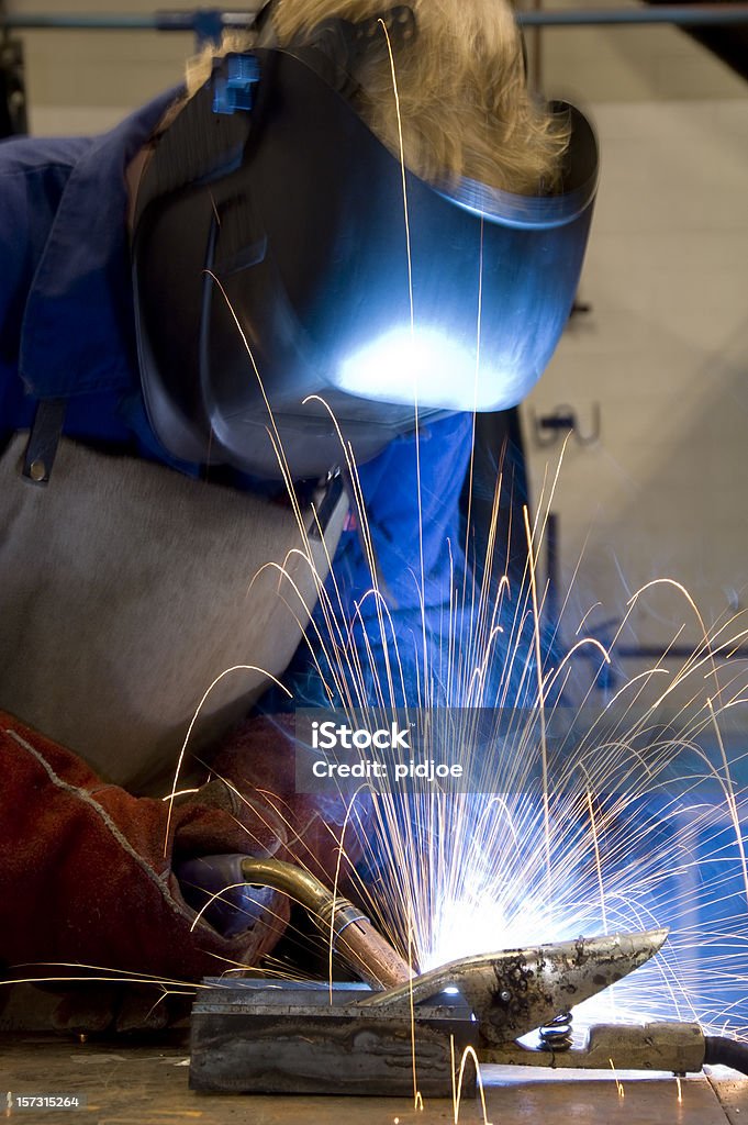 welding with sparks allover  Adult Stock Photo