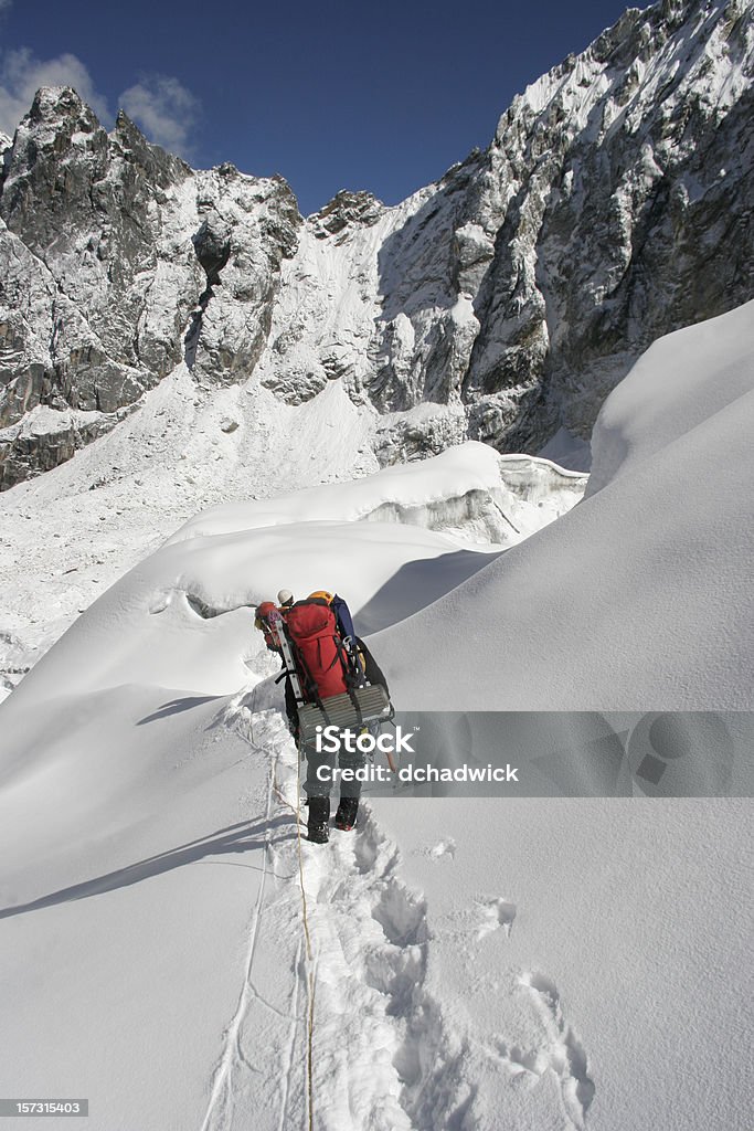 Descending Two climbers descending a glacier in the Nepal Himalaya Asia Stock Photo