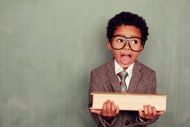 Knowledge Yes, learning is fun and will blow your mind. A young boy is ready for his education. teacher classroom child education stock pictures, royalty-free photos & images