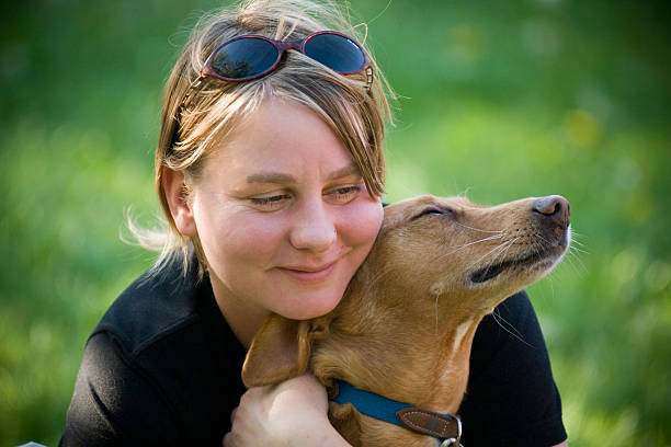 istock Woman hugging her dog 157315512