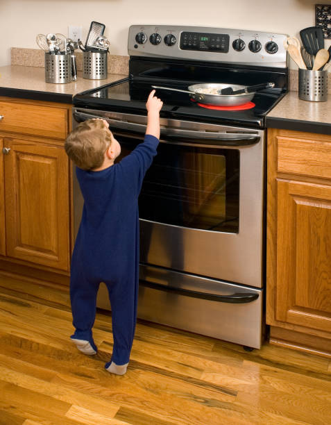 istock Hot Stove Danger Toddler Reaching 157315583