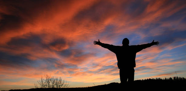istock Unrecognizable Man With Arms Outstretched in Worship 157315590