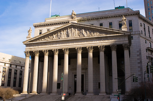 Image of Aerial of government buildings with focus on city hall and distant view of San Francisco Bay