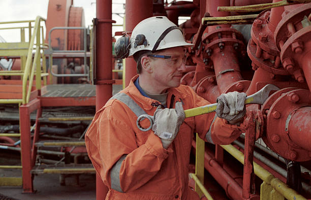 istock Oil rig worker fixing the pipes 157315939