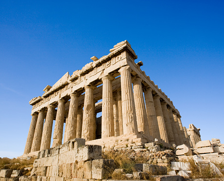 The Doric-style temple Parthenon and its cotinthian columns,designed by Phidias to the Greek goddess Athena, at Acropolis hill. Athens, Greece.