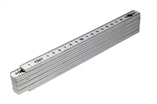 hand holding ruler with canvas background
