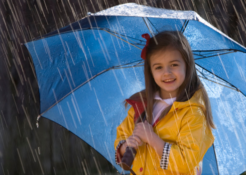 beautiful young teenager girl in paris on the background of the eiffel tower in a long elegant dress in the style of romanticism walks with an umbrella from the sun and smiles at her long blonde hair and around good weather and in the background the eiffe.