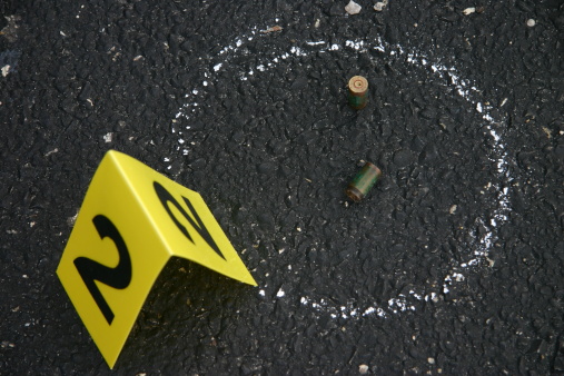 Bullet shell casings marked off at a crime scene