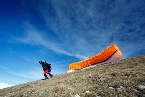 Paraglider and paraglider wing in the Slovenian Alps.