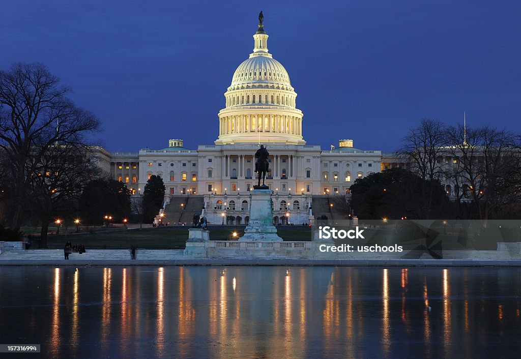 Illuminated US Capitol building with reflection on ice the west of the United States Capitol State Capitol Building Stock Photo