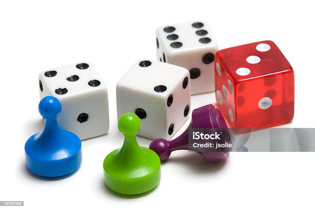 Three game pieces and four dice  Board Game Stock Photo