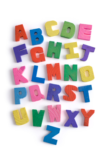 Alphabet letters backgrounds with word DYSLEXIA on bright yellow background