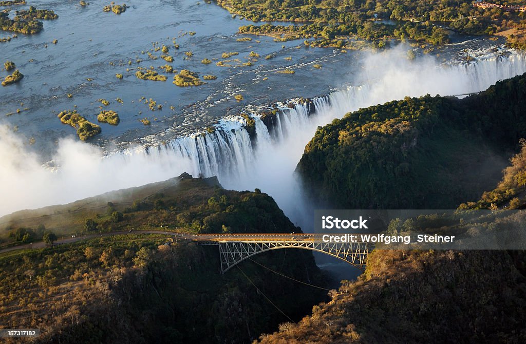 Panoramic view of Victoria Falls and the old bridge Seen at the Victoria Falls in june 2007 - Zimbabwe Zimbabwe Stock Photo
