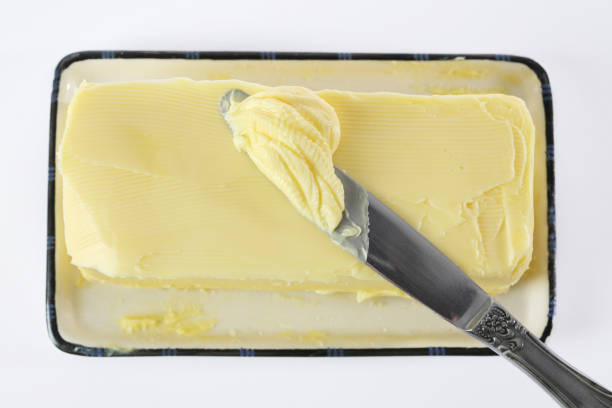 butter knife in butter, from above, similar image: margarine stock pictures, royalty-free photos & images