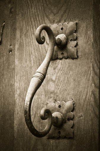 Old black wooden door and doorknob