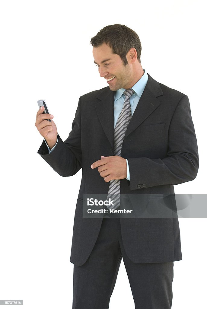 Hombre de negocios mirando a un teléfono móvil - Foto de stock de Fondo blanco libre de derechos