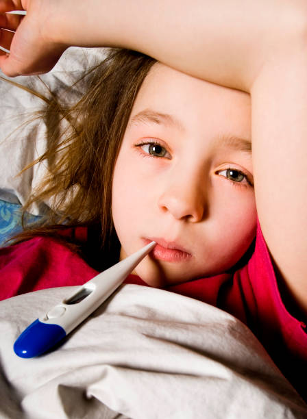 istock Taking temperature of small child not feeling well 157317744