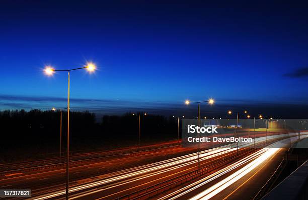Manchester Rush Hour At Dusk With Traffic Trails Stock Photo - Download Image Now - Multiple Lane Highway, Night, UK