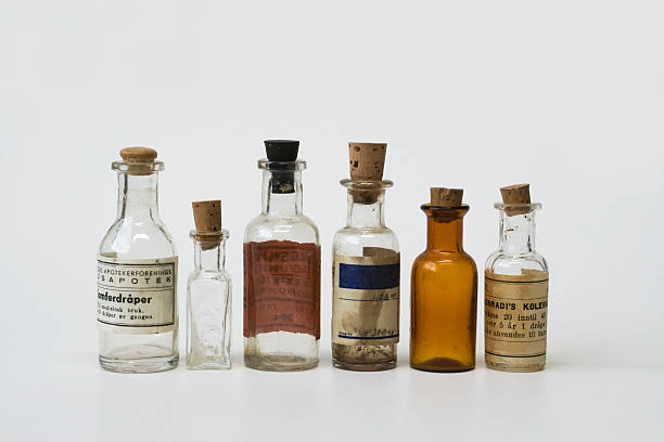 Group of small vintage translucent medicine bottles. stock photo