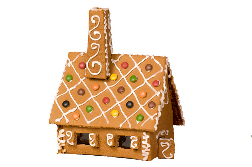 Colorful Christmas gingerbread men. Traditional delicacy of different shapes and colors on a wooden background. With copy space