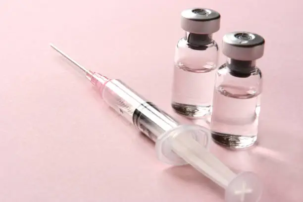 Photo of Vaccination: Syringe and Vials with Medicine