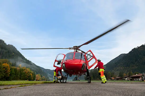 paramedics preparing rescue helicopter for take off, Bernese Oberland Switzerland, Lenklypse 2012