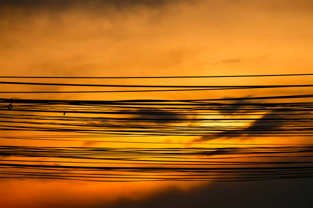 Silhouette electric wire on evening sunlight.