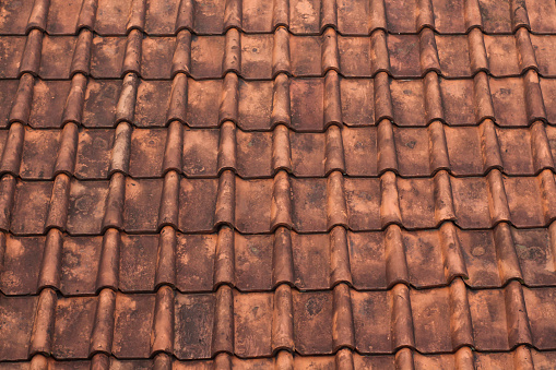 background and texture of a red tile on an old house
