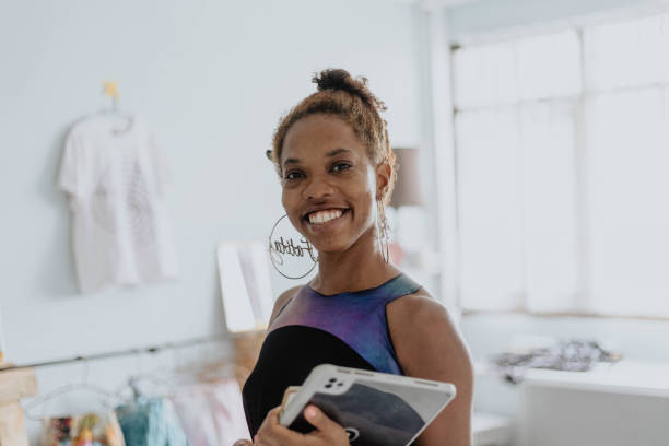 istock Woman Smiling And Happy in Home Studio 1573211360