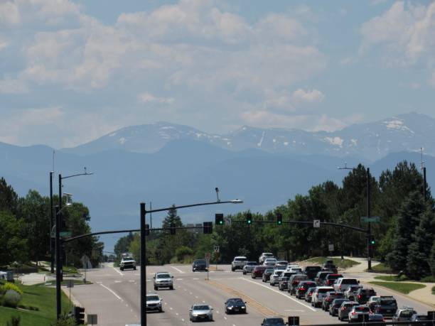 istock Traffic with rocky mountains in the background 1573234965