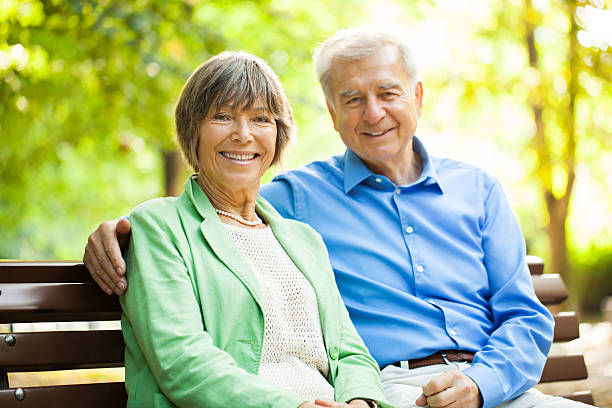 istock Senior couple enjoying time together at the park 157325321