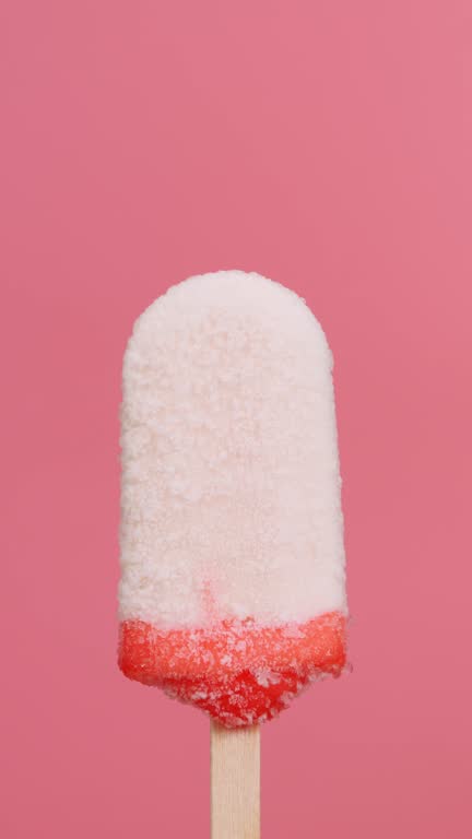 Popsicle isolated melt on pink background.