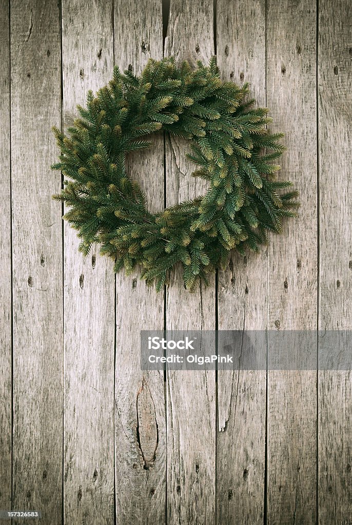 Green Christmas Wreath on Wooden Background Branch - Plant Part Stock Photo