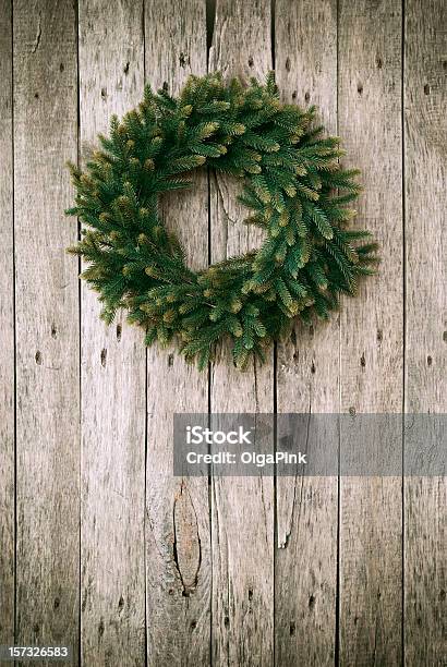 Green Christmas Wreath On Wooden Background Stock Photo - Download Image Now - Branch - Plant Part, Celebration, Christmas