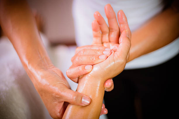 Hand massage oil hand massage, aromatherapy. hand massage photos stock pictures, royalty-free photos & images