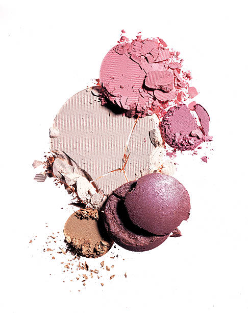 Crushed makeup Crushed makeup on white background. The makeup included foundation, powder brush and eye shadows. makeup product photography stock pictures, royalty-free photos & images