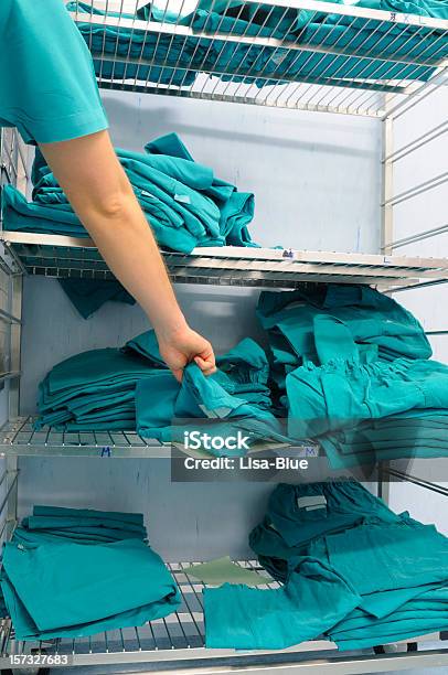 Surgeon Taking Clean Scrubs Stock Photo - Download Image Now - Nurse, Shelf, Adult