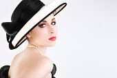 Beautiful Young Woman as Chanel Girl in Hat and Pearls
