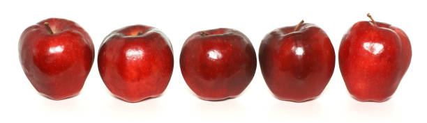 istock row of five red apples on white 157328083