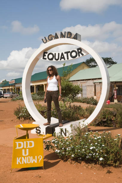 istock Equator in Uganda with young woman 157329096