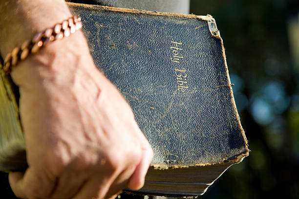 istock Antique Bible in Hand 157329104